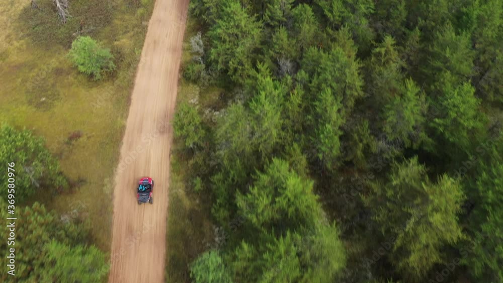 ATV driving through the woods in Northern Michigan