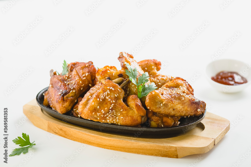chicken wings with sesame on white background chicken wings with sesame on white background