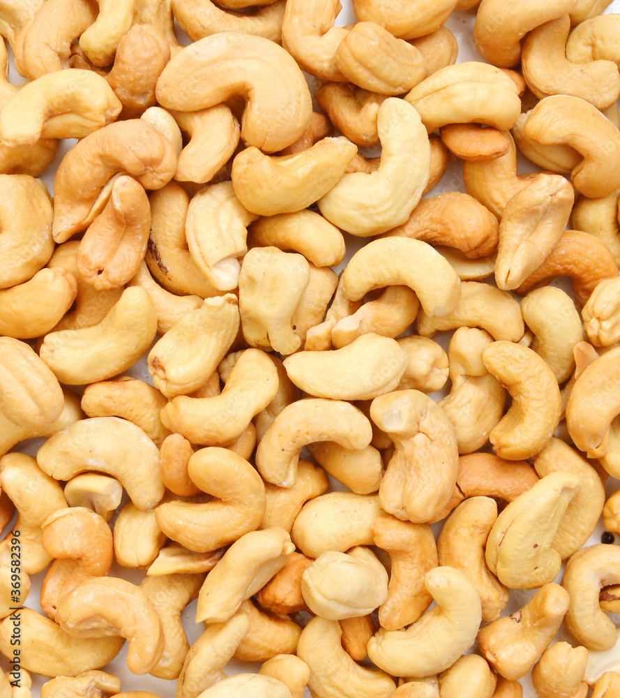 Roasted cashew nuts on background