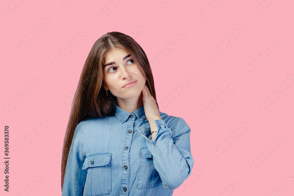 girl thinking and looking up, confused about an idea girl thinking and looking up, confused about an idea