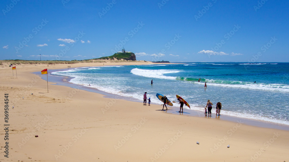 People on the beach at Nobby's beach, Newcastle, NSW, Australia