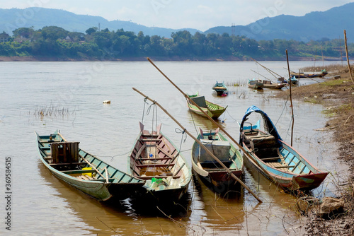 Fishing boats on the Mekong river, Luang Prabang, Laos.