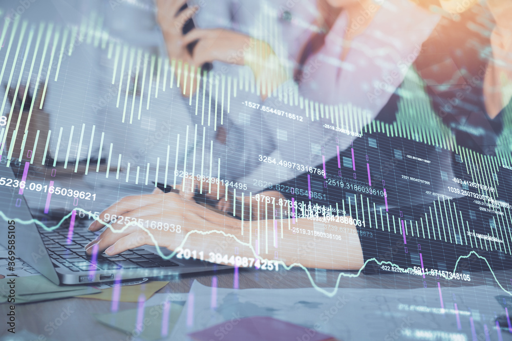 Multi exposure of woman hands typing on computer and financial graph hologram drawing. Stock market analysis concept. Multi exposure of woman hands typing on computer and financial graph hologram drawing. Stock market analysis concept.