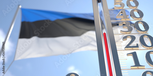 30 degrees centigrade on a thermometer measuring air temperature near flag of Estonia. Hot weather forecast related 3D rendering
