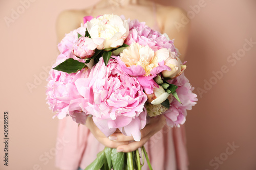 Wallpaper Mural Woman with bouquet of beautiful peonies on beige background, closeup Torontodigital.ca