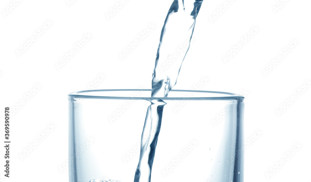 Pouring water into glass on white background, closeup Pouring water into glass on white background, closeup