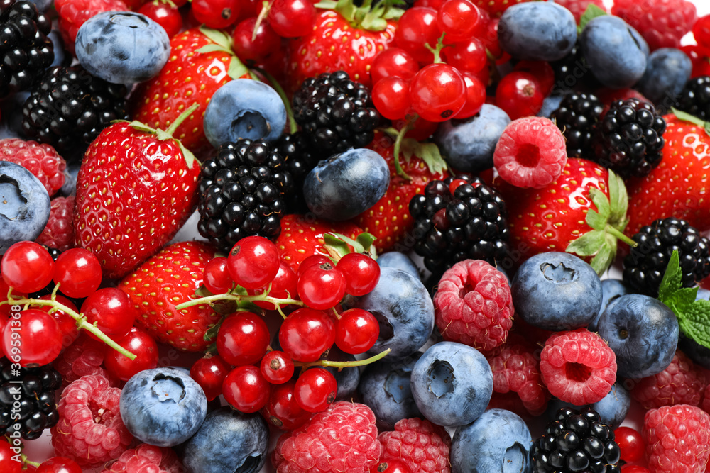 Mix of fresh delicious berries as background, top view