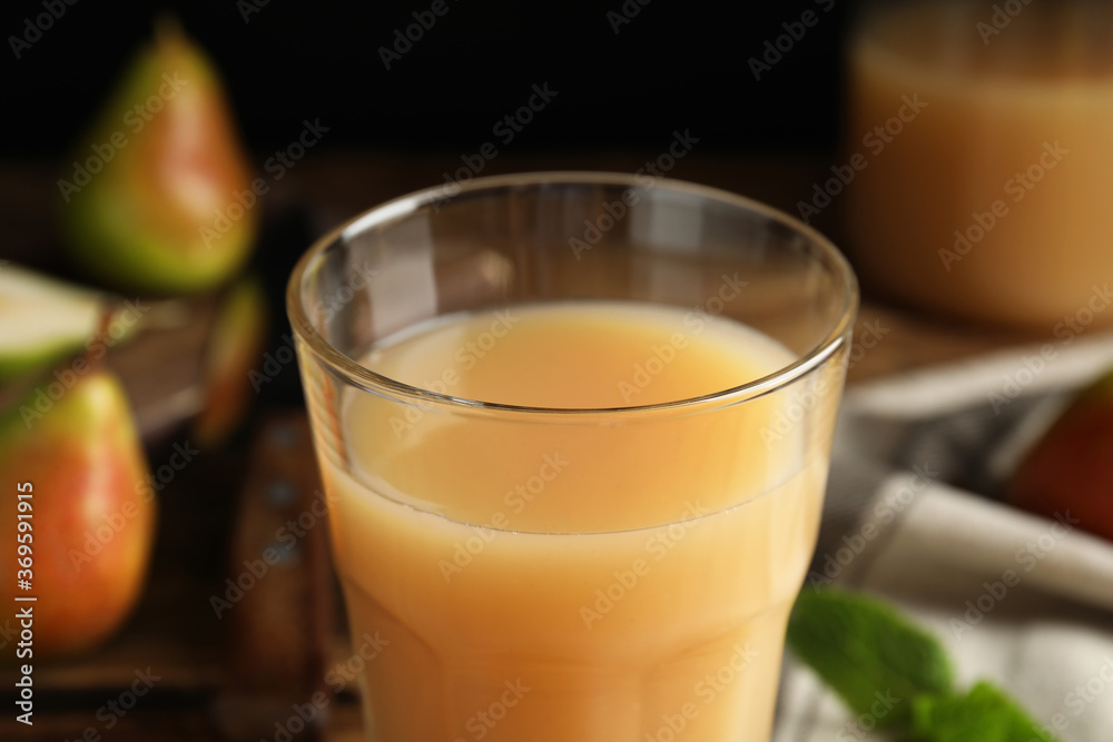 Fresh pear juice in glass, closeup view Fresh pear juice in glass, closeup view