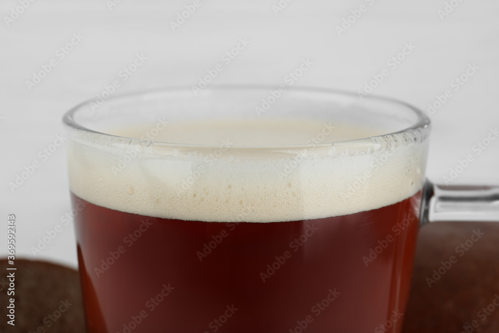 Glass of delicious kvass on blurred background, closeup Glass of delicious kvass on blurred background, closeup
