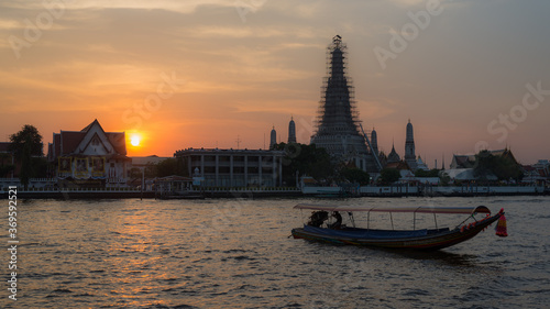 boat on river in front of temple in bangkok © JS_Fotoworx
