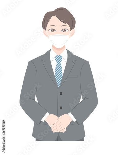 A man in a mask greets us. A guide to businessmen in suits.