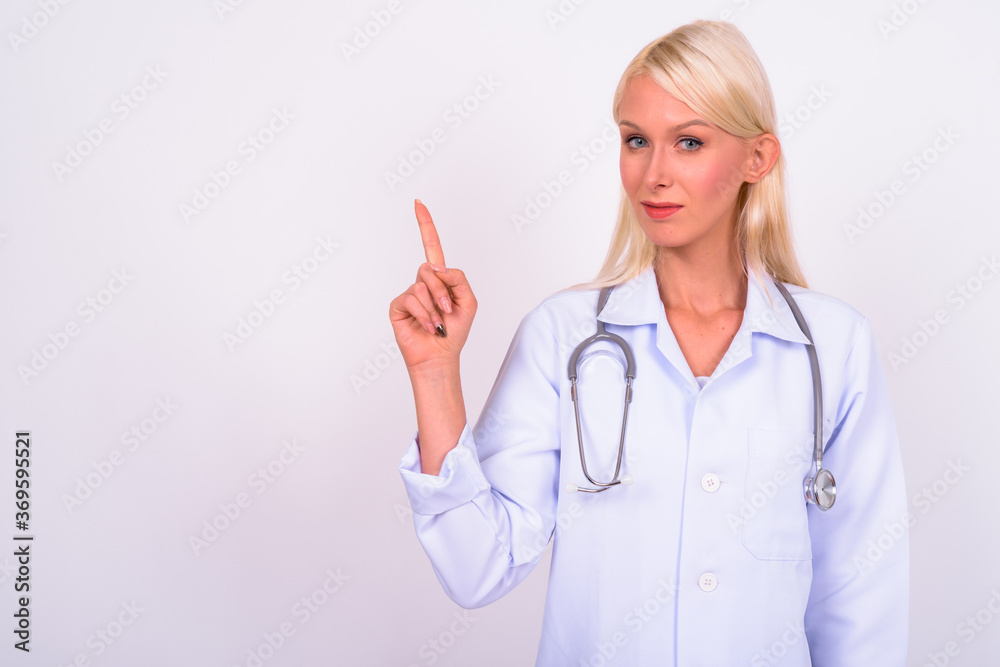 Portrait of young beautiful woman doctor with blond hair Portrait of young beautiful woman doctor with blond hair