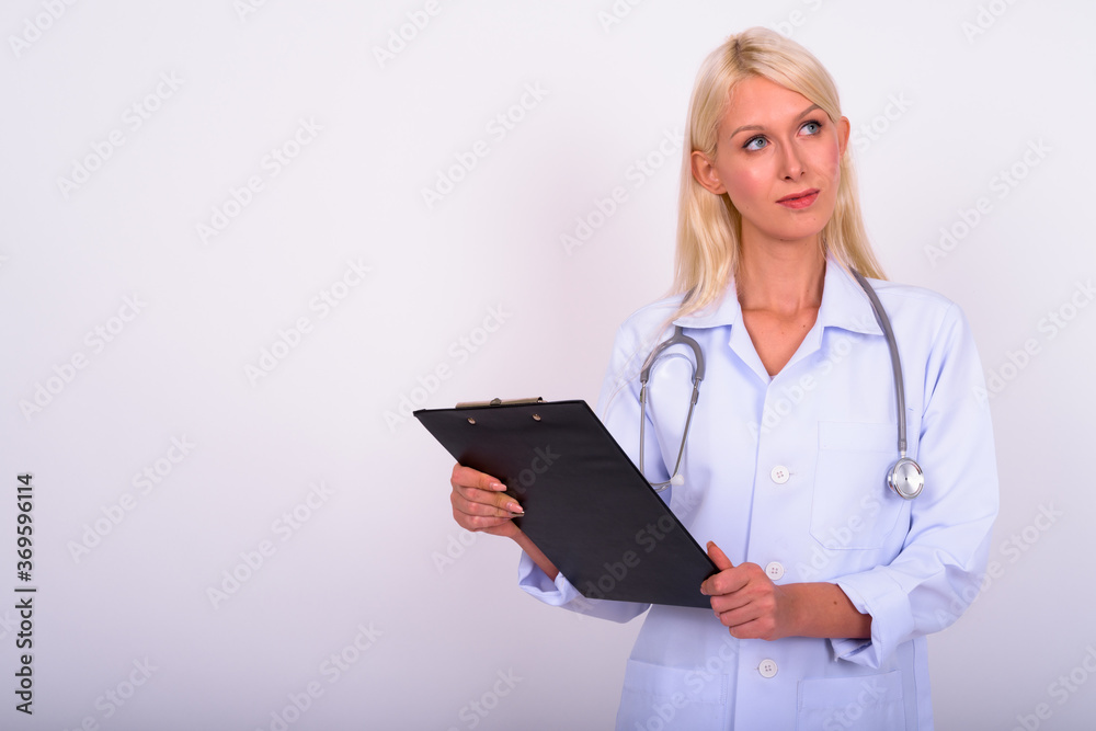Portrait of young beautiful woman doctor with blond hair Portrait of young beautiful woman doctor with blond hair
