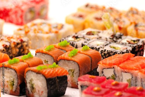 Layout of Japanese rolls with elements of a blurred background.