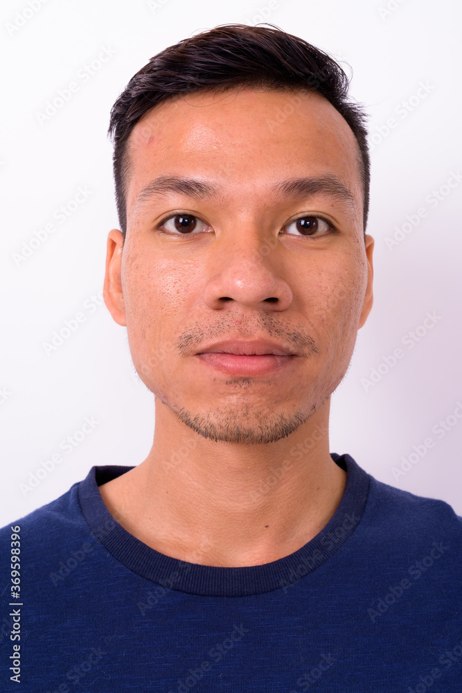 Obraz premium Portrait of young Asian man with beard stubble