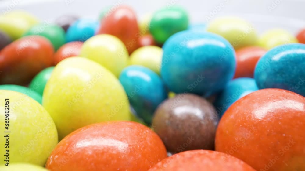 A heap of colorful candies on top of the table A heap of colorful candies on top of the table