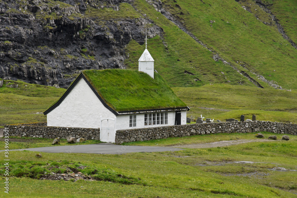 Turf-roofed, white-washed church in village of Saksun, Stremoy Island, Faroe Islands