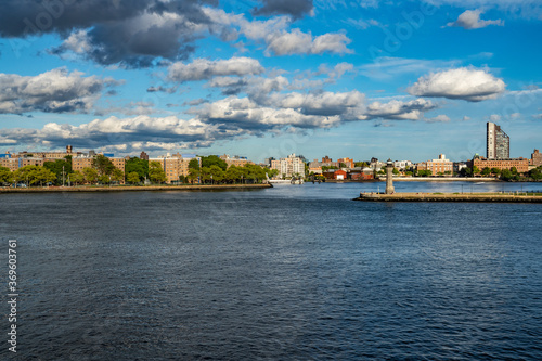 River view with lots of dark clouds and a lighthouse