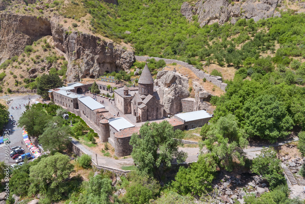 beautiful scenic landscape with historic Geghard monastery on steep mountain with dramatic scenery, Armenia
