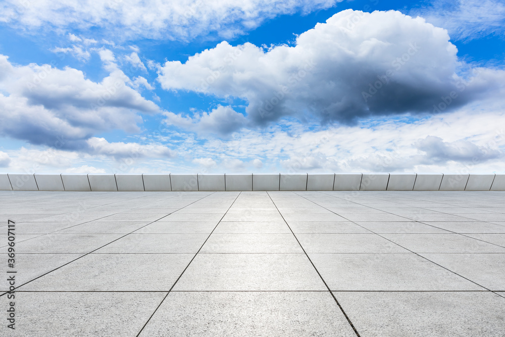 Empty square floor and blue sky with white clouds scene.