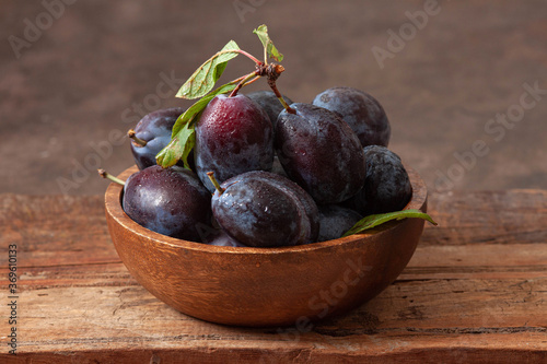 fresh plums in a bowl