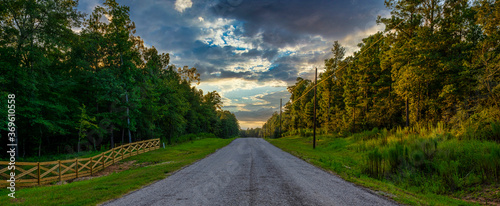 Country road with summer sunset