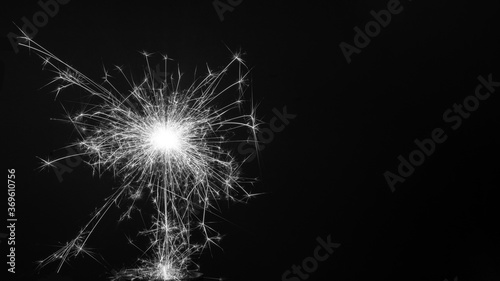 Burning sparklers isolated on black background, copy space, New Year Christmas concept