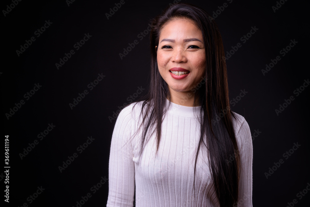 Portrait of happy young beautiful Asian woman Portrait of happy young beautiful Asian woman