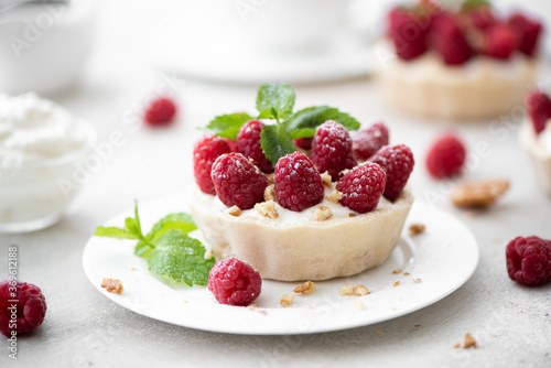 dessert with mascopone cheese, fresh raspberries and nuts
