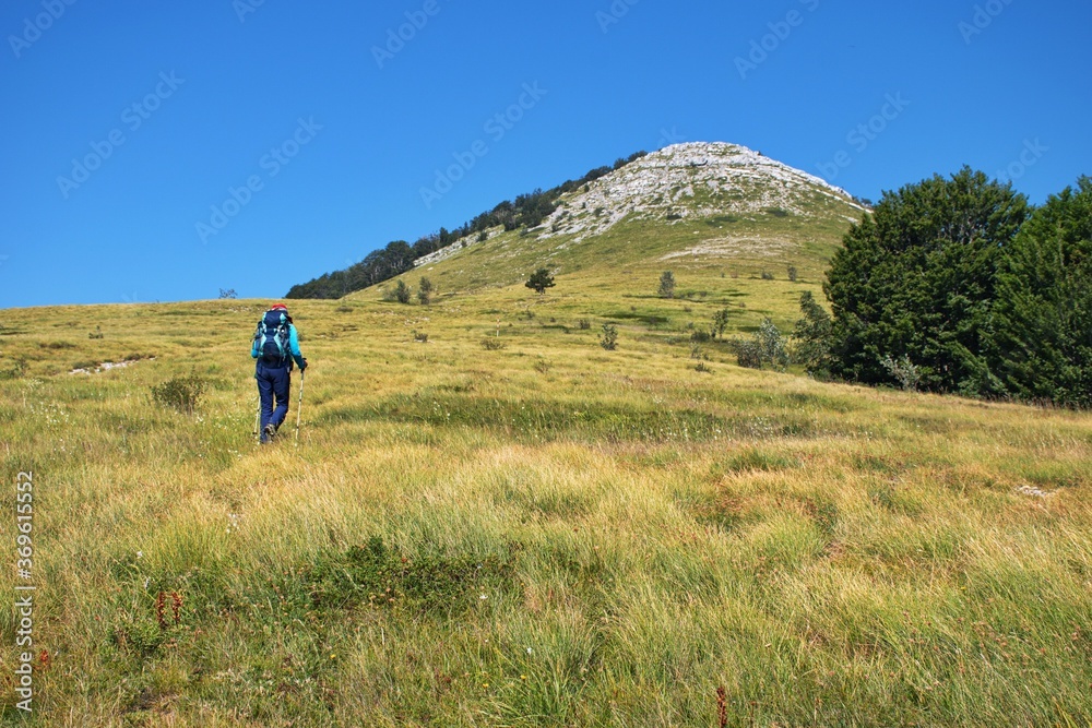 Senior woman hiking in Velebit mountain, Croatia
