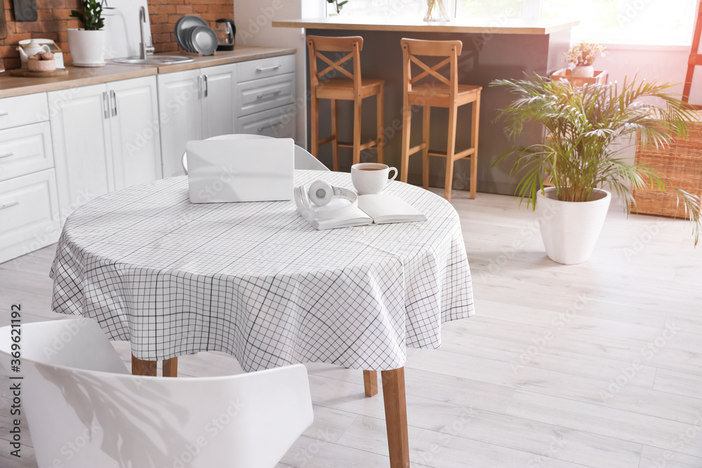Dining table in interior of modern kitchen