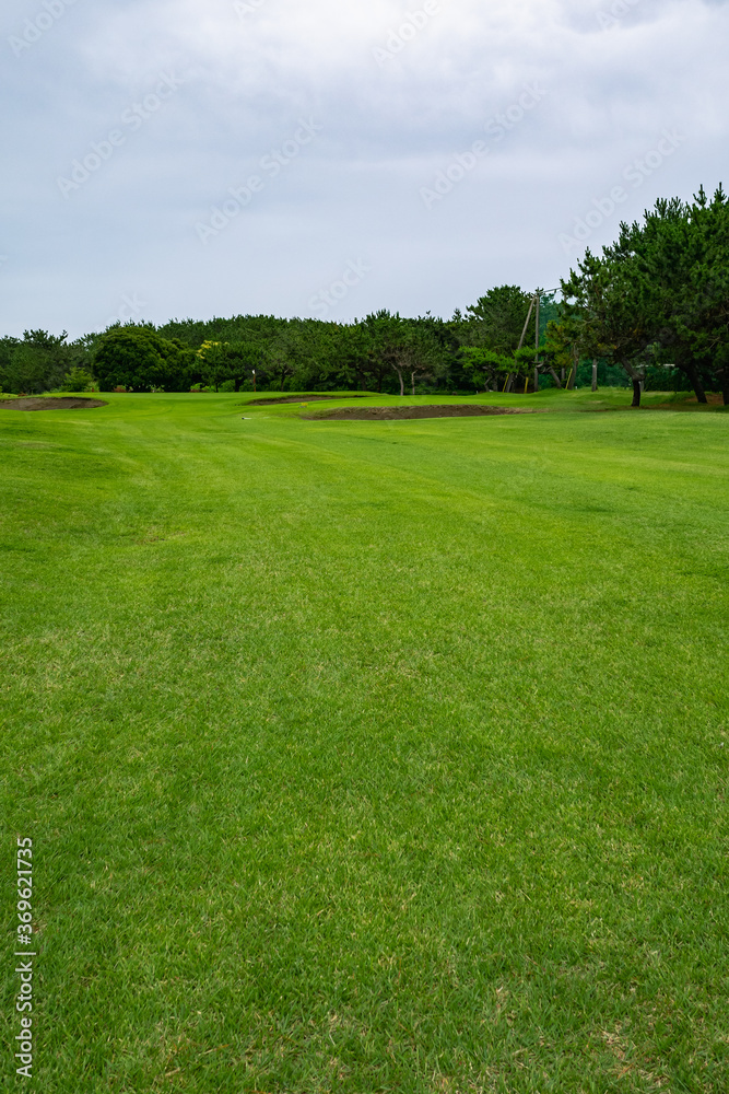 Golf Course with beautiful green field. Golf course with a rich green turf beautiful scenery.