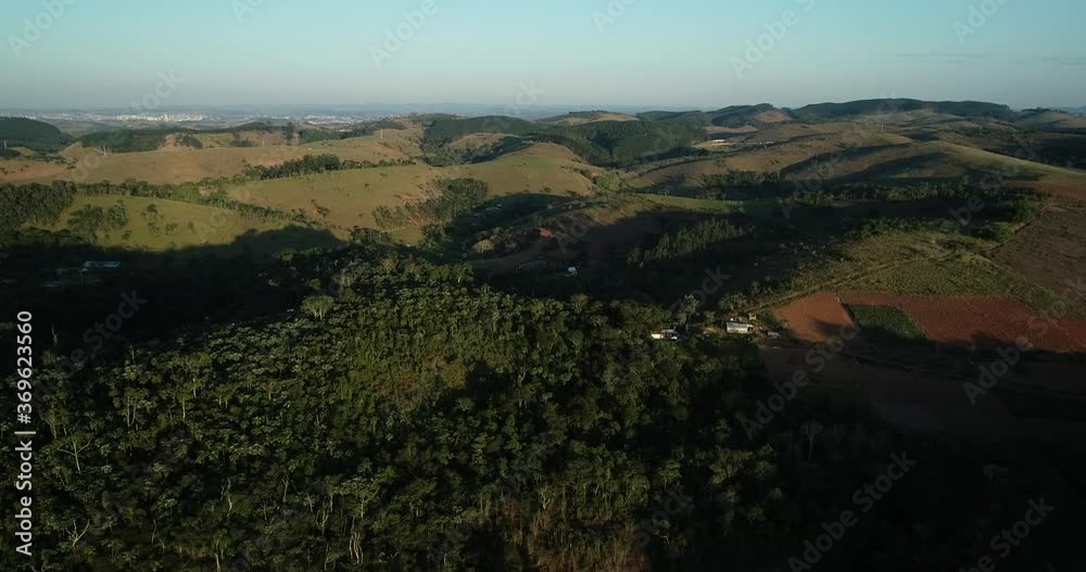 Moving forward with Drone filming mountains and large trees in lush green countryside, in resolution 4K, peace, serenity, love, motivation Moving forward with Drone filming mountains and large trees in lush green countryside, in resolution 4K, peace, serenity, love, motivation