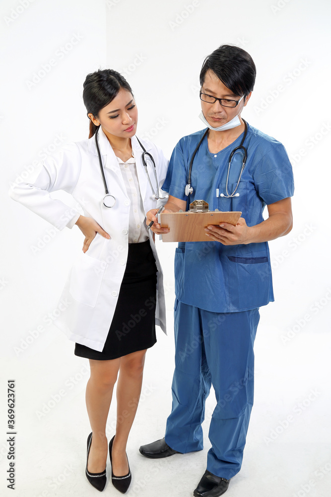 Young Asian male female doctor wearing apron uniform stethoscope clipboard talk write discuss Young Asian male female doctor wearing apron uniform stethoscope clipboard talk write discuss