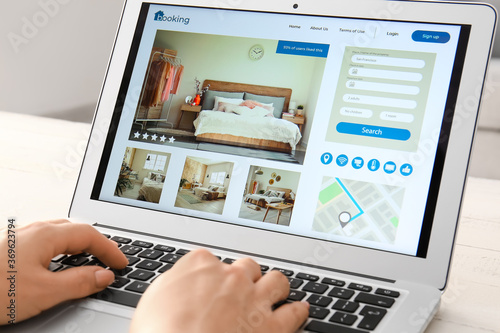 Woman with laptop booking r...