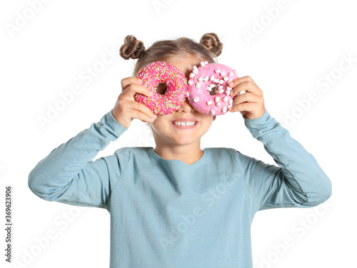 Funny little girl with donu...