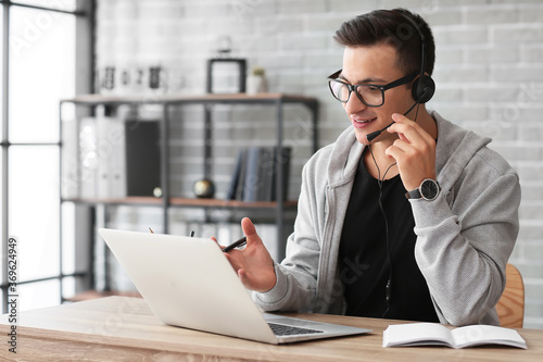 Man with headphones and lap...