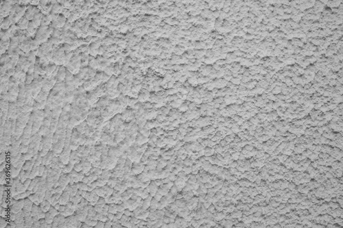 evocative black and white image of plastered wall texture