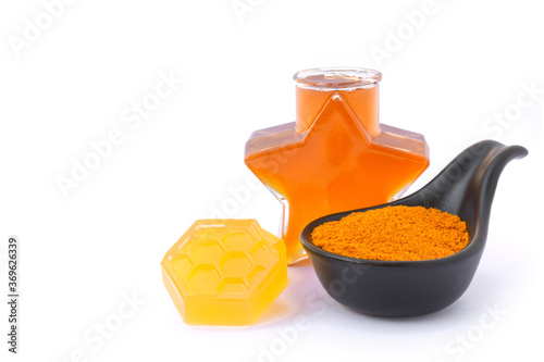 Turmeric powder,  honey,  tumerichoney soap isolated on white background. Herbal medicine plant, beauty and spa, skin care concept. photo