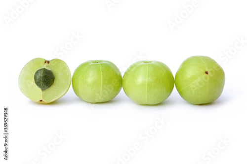 Fototapeta Naklejka Na Ścianę i Meble -  Indian gooseberry fruits ( Amla,  phyllanthus emblica ) and half sliced isolated on white background. 