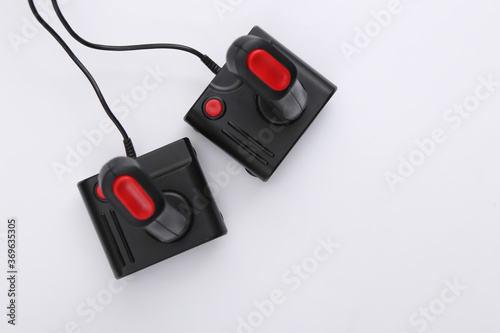 Two retro joysticks on white background. Gaming, video game competition. Top view, minimalism