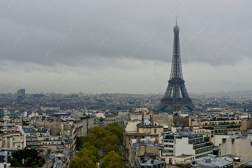 View of the Eiffel tower towering above all other buildings in the city