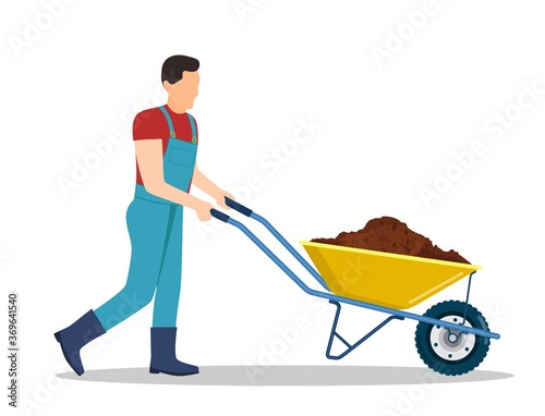 Valokuvatapetti Man with wheelbarrow full of dirt or ground