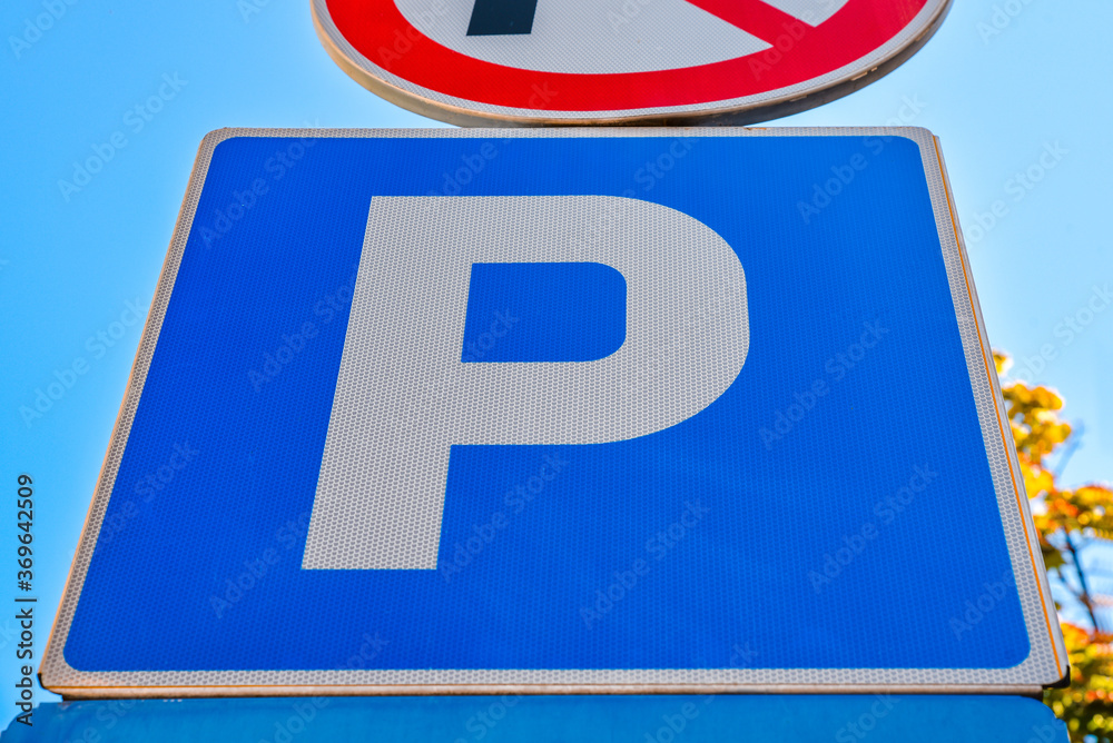 Blue sign for free parking with sky background Blue sign for free parking with sky background