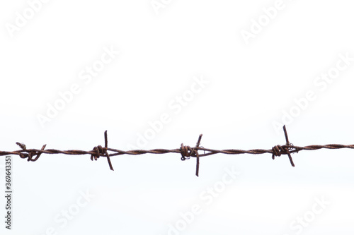 barbed wire against a white background © Touchi