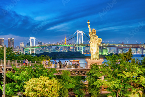 Photography Night view of Statue of Liberty and Rainbow Bridge in Odaiba, Tokyo
