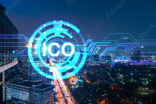 Initial coin offering hologram, night panorama city view of Bangkok, the center of cryptocurrency projects in Asia. The concept of widespread ICO hysteria. Double exposure.