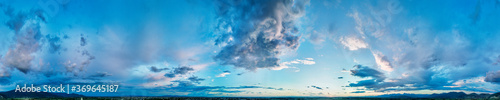 Drone viewpoint of sunset sky in summer season. Panoramic view of dusk clouds photo