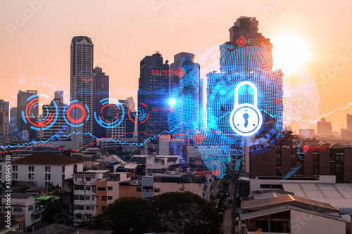 Hologram of Padlock on sunset panoramic cityscape of Bangkok, Asia. The concept of cyber security intelligence. Multi exposure.