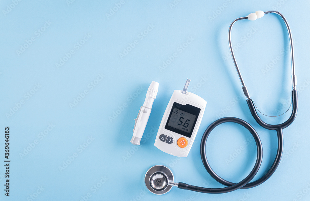 Healthcare and medical concept, Stethoscope and blood glucose meter sets on blue background, World Diabetes day, 14 November. - obrazy, fototapety, plakaty 